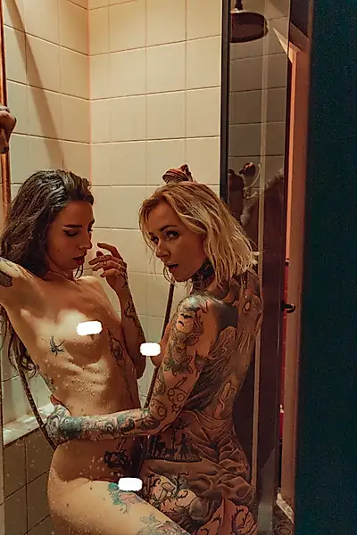 Two dirty girls showering