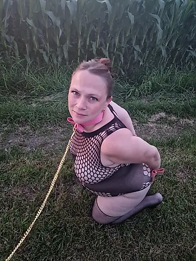 Pregnant woman in her 8th month, cornfield